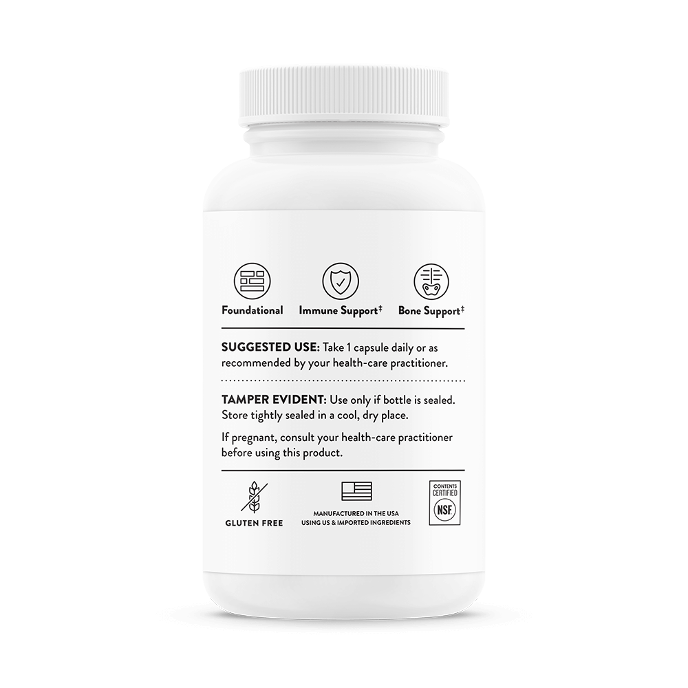 White supplement bottle with label on a black background